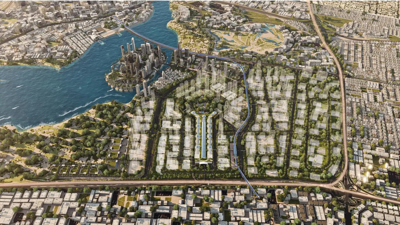 Emaar's aerial rendering of the Dubai Creek Harbour masterplan: Creek Island in the Creek, Creek Beach behind it, tower clusters along the Blue Line route and the Dubai Square spine